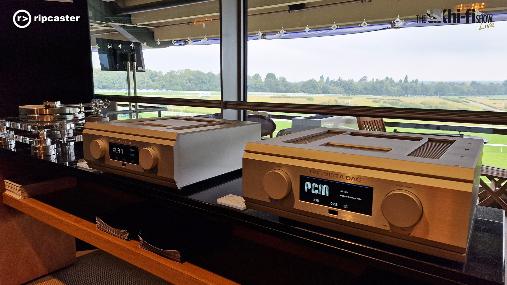 HiFi equipment on a long table with the racecourse in the background