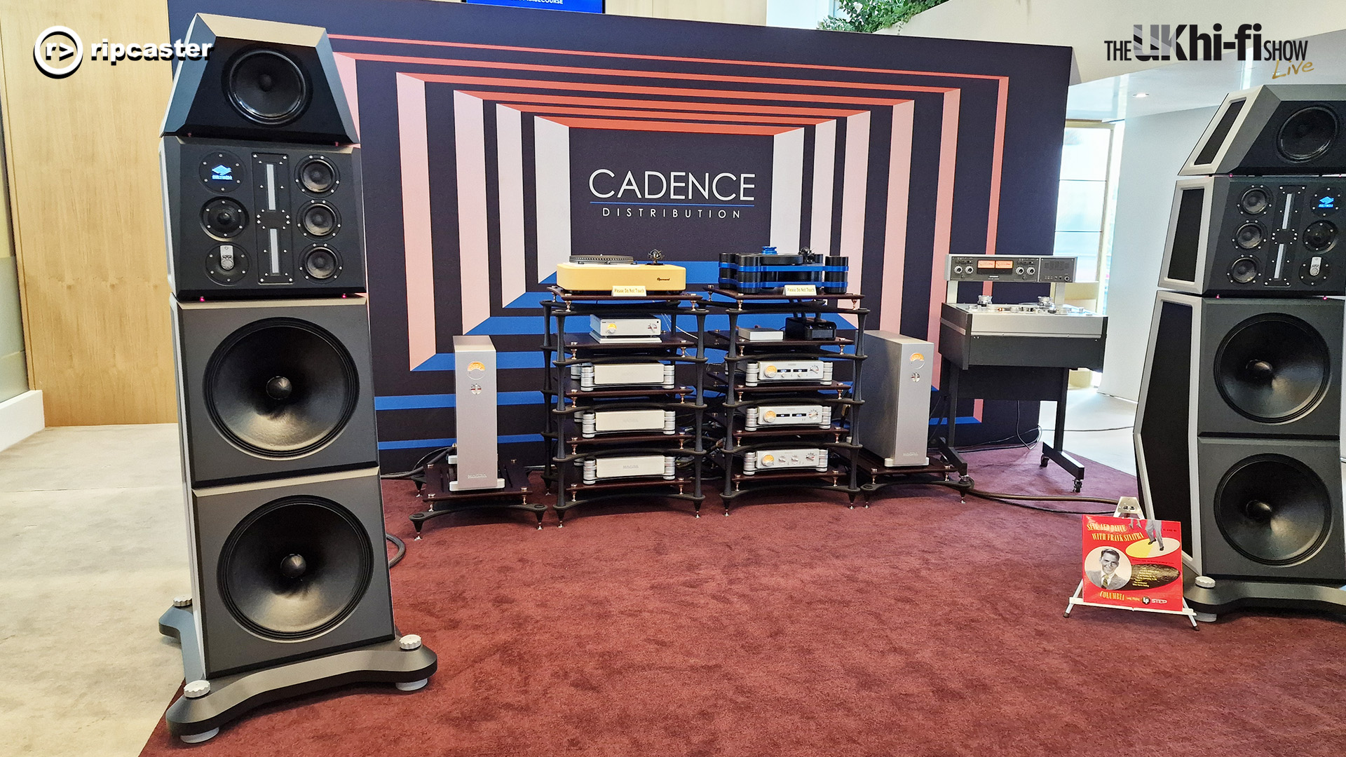 Cadence.  A pair of large floorstanding speakers either side of two stacks of HiFi equipment