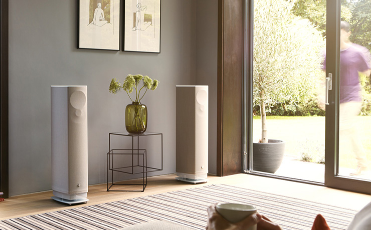 A pair of Linn 530 speakers in a living space with a low shelf unit between them