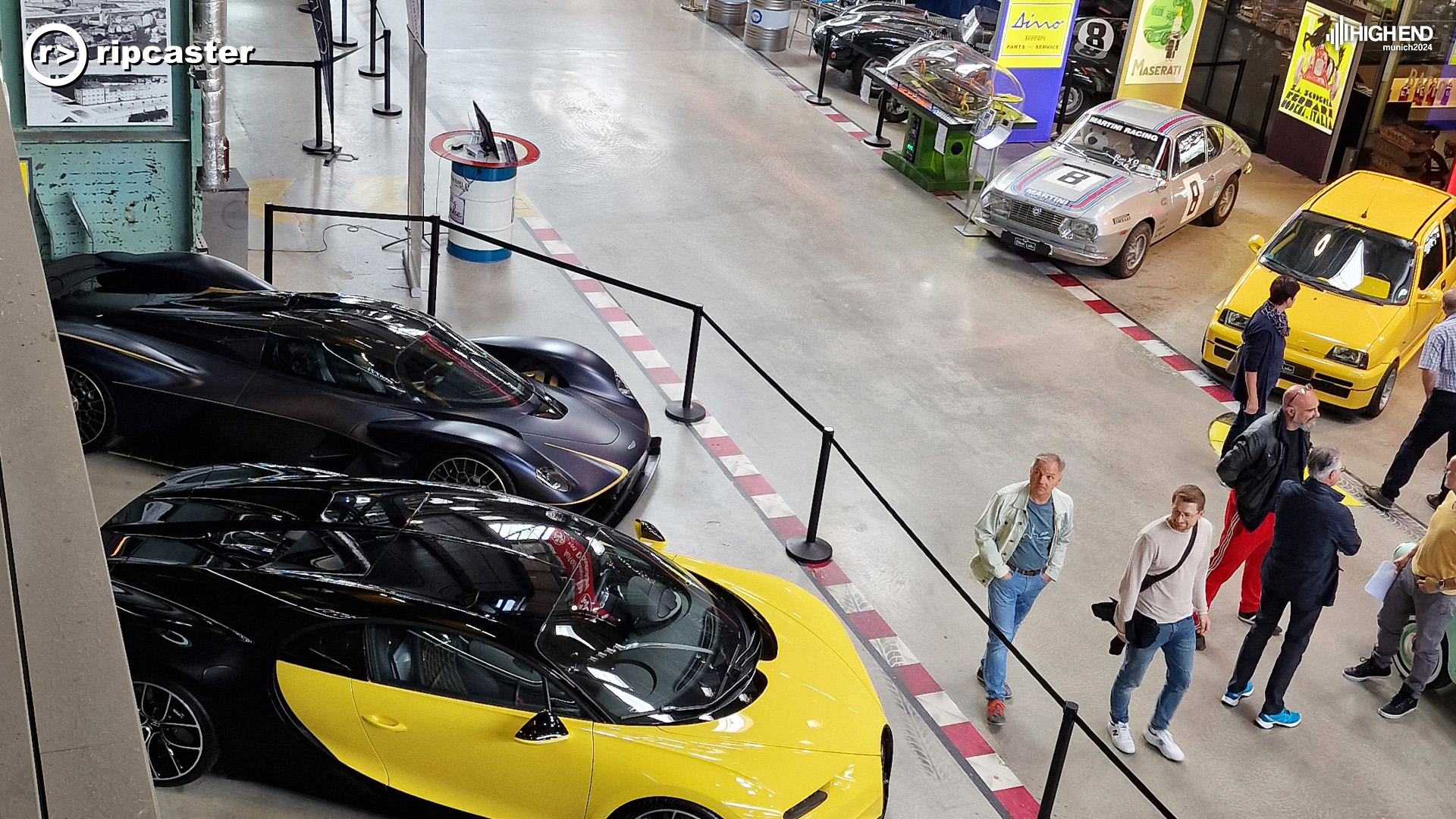 Some very fancy cars on the left including a black one that looks like the Bat Mobile.  On the right are classic cars.