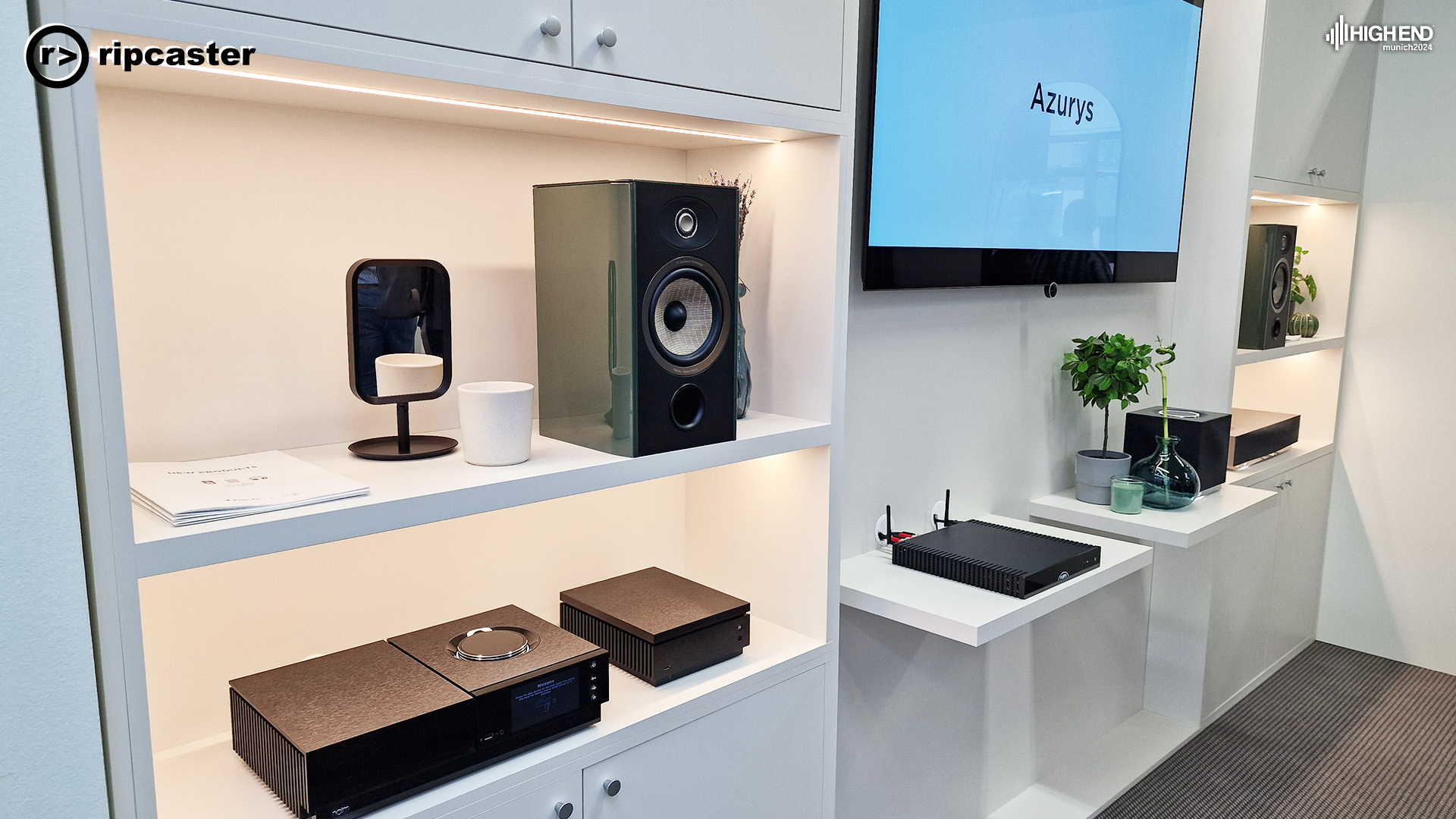 HiFi equipment on white shelves of varying heights