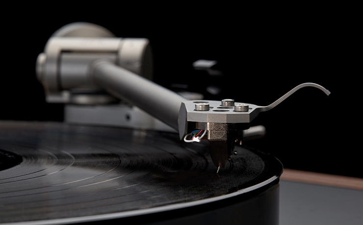 A close-up of the Linn Klimax tonearm sitting on a record