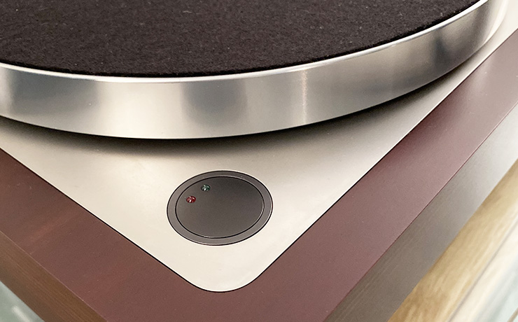 The corner of the Linn LP12-50 showing the on/off button which is circular