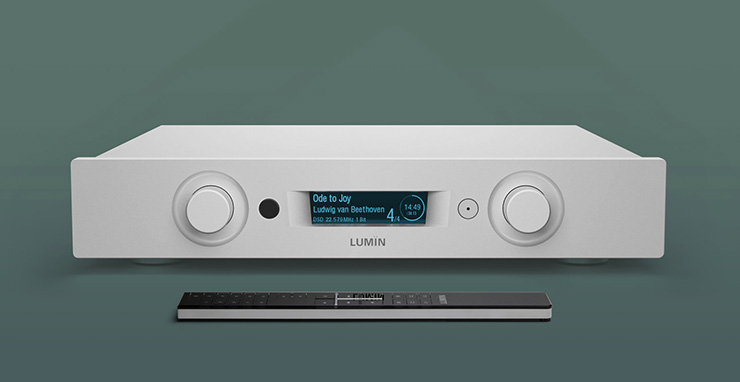 Lumin P1 Mini - Streamer, DAC, Pre-Amp with a remote control in front of it.  On a green background.