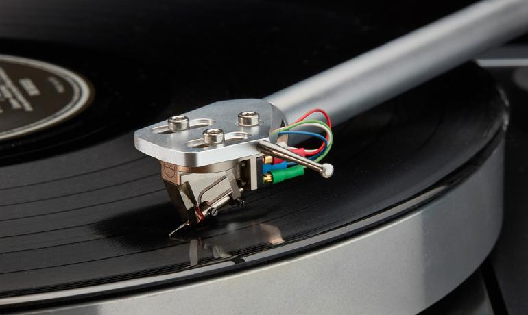 Linn LP12 close-up of a tonearm and cartridge on a record
