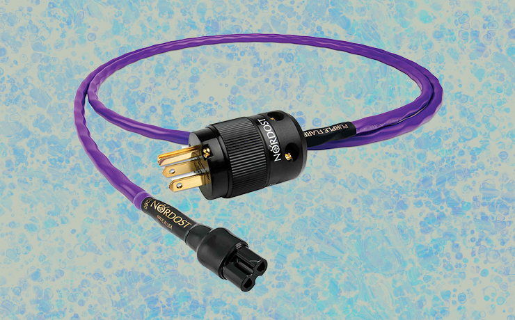Nordost Purple Flare Power Cable on a splodgy light and dark blue background.