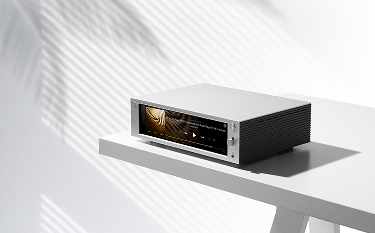 Professional HiFi Media Player RS201E on a table with a pale wall behind