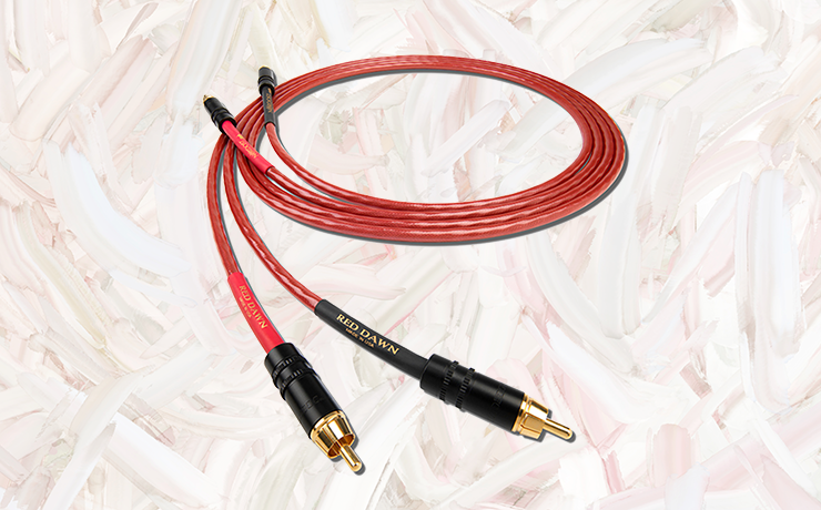 Nordost Red Dawn Analogue Interconnect Cable on a painted cream and salmon background