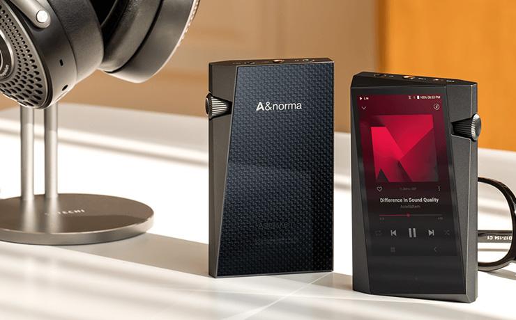 A pair of Astell & Kern SR35 Music players standing up.  One facing the front and one facing the rear.