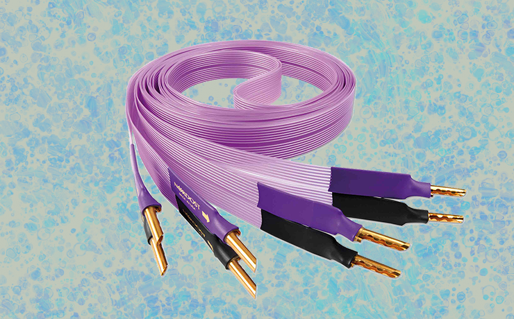 Nordost Purple Flare Speaker Cable on a light and dark blue splodgy background.