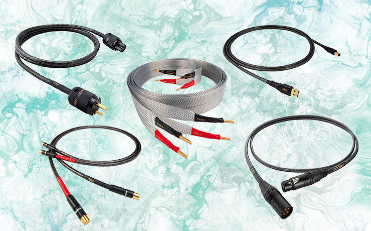 Nordost Tyr 2 Cables on a green splodgy background.  Cables include Power, speaker and USB cables.