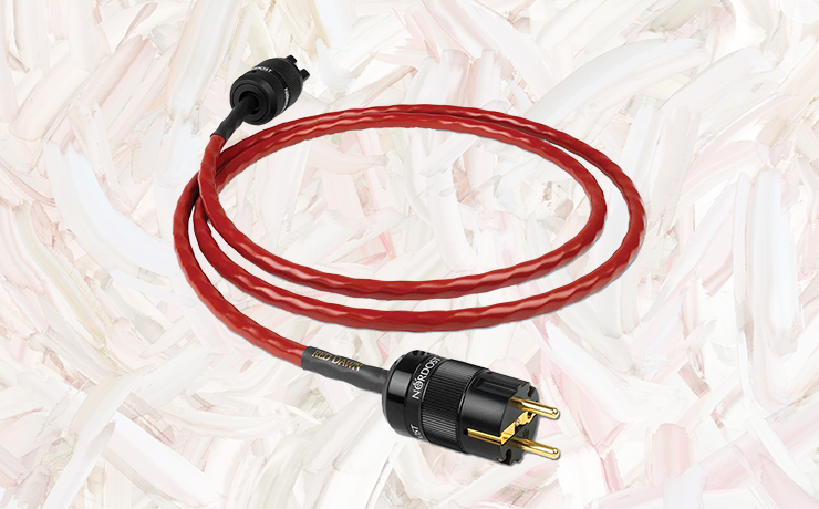 Nordost Red Dawn Power Cable on a painted cream and salmon background
