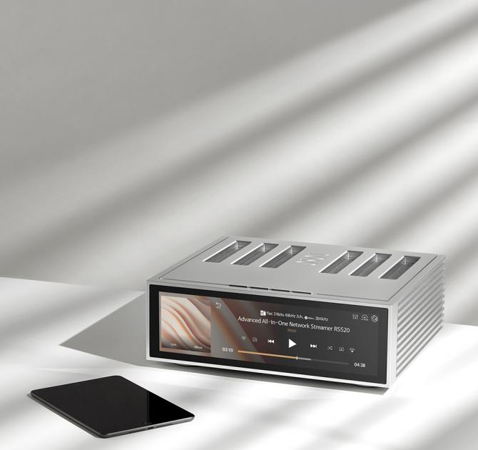 HiFi Rose RA520 Network Streamer in silver on a table with an iPad in front of it