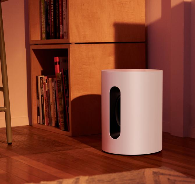 SONOS Sub Mini on the floor in the corner of a living room