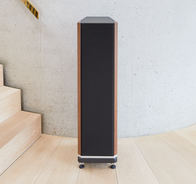 A single Kudos Titan 707 speaker with grill on at the foot of a modern staircase.