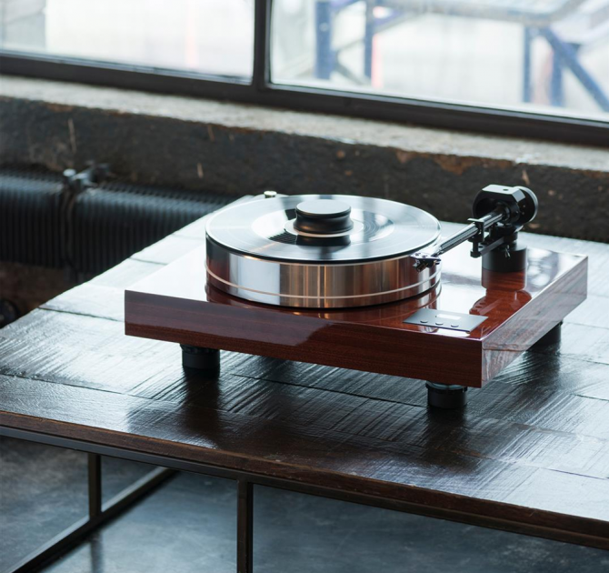 Project Xtension 10 (no cartridge) - Turntable on a low wooden table in an apartment.