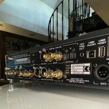MOON 791 Network Player/Preamplifier rear view with the top of a spiral staircase in the photo