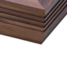 The corner of a Linn LP12 Fluted Plinth turntable in Walnut