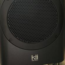 Close-up of the Kii Seven speaker in black
