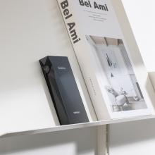 Astell & Kern A&ultima SP3000M Portable Music Player beside a book